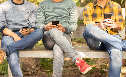 Group of people sitting on bench