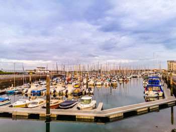 Boats moored at harbor