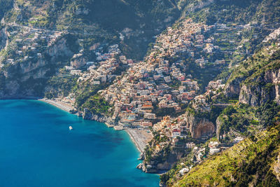 High angle view of townscape by sea