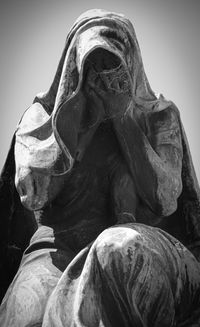 Low angle view of statue against sky