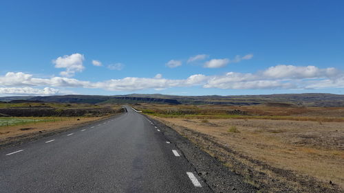 Road amidst landscape against sky