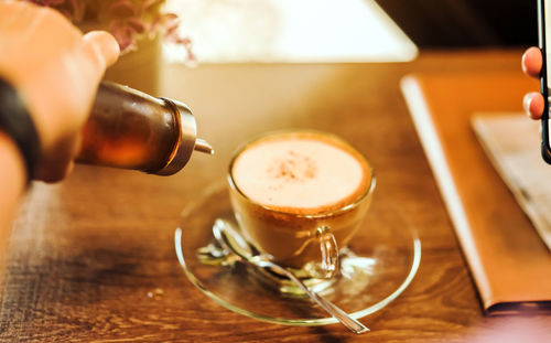 Close-up of coffee cup on table