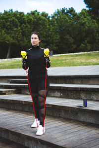 Woman standing by railing
