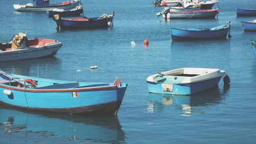 Boats moored in sea