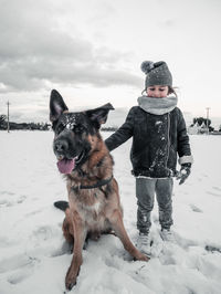 Dog on snow covered land