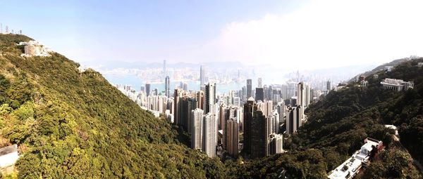 Panoramic view of buildings in city against sky