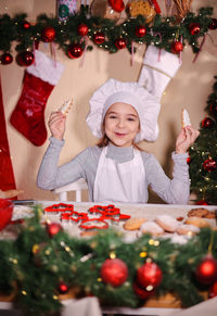 Portrait of cute girl with christmas tree