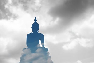 Low angle view of statue against sky