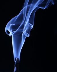 Close-up of smoke against black background