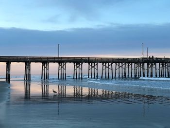 Pier on sea against sky