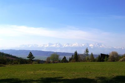 Scenic view of landscape against cloudy sky
