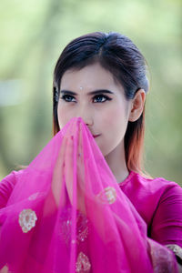 Portrait of smiling young woman in traditional clothing