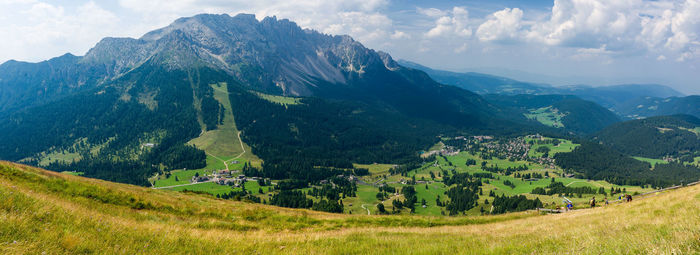 Panoramic view of mountains against cloudy sky