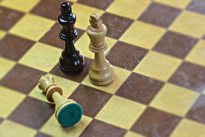 High angle view of chess pieces on floor