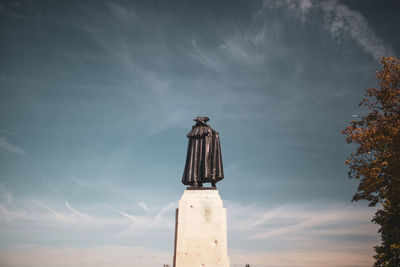 Low angle view of statue against sky