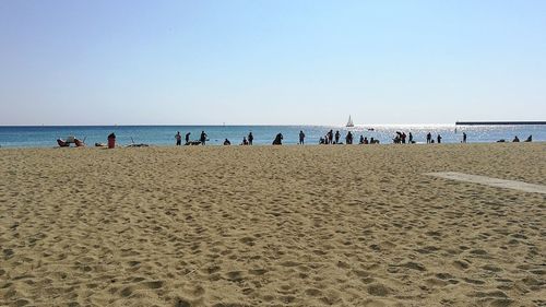 Scenic view of beach against clear sky