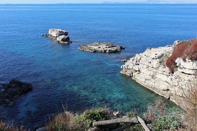 High angle view of rocks in sea