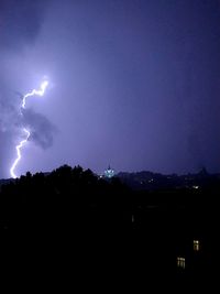 Silhouette of lightning at night