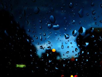 Full frame shot of raindrops on window