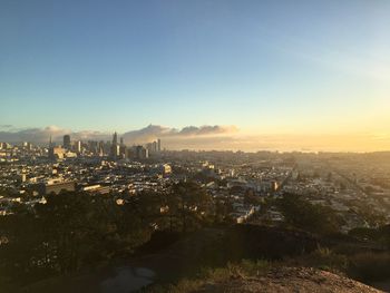 Aerial view of cityscape against clear sky