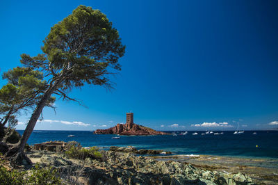 Scenic view of sea against clear blue sky