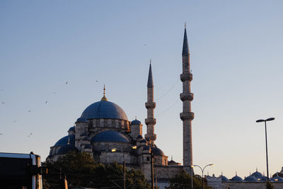 Low angle view of mosque against clear sky