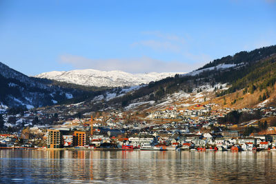 Scenic view of snowcapped mountains against clear blue sky