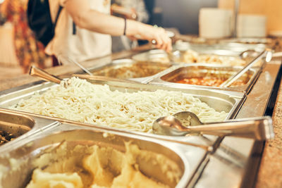 Midsection of woman preparing food