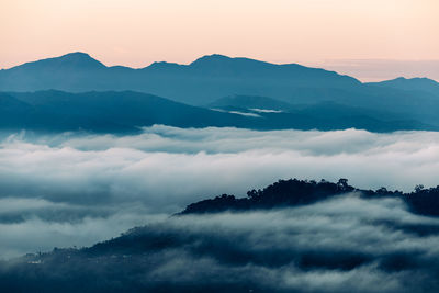 Scenic view of mountains against sky during sunset