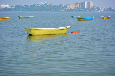 Boats moored in sea