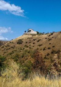 Scenic view of landscape against blue sky