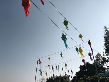 Low angle view of decoration hanging against clear sky
