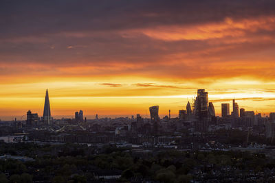 Cityscape against sky during sunset