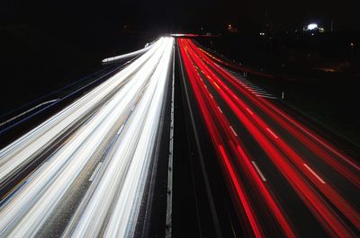 Blurred motion of car on road at night