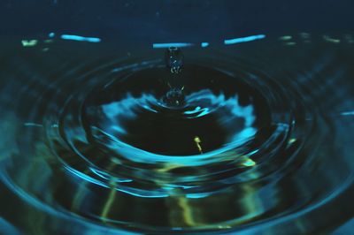 High angle view of drop falling in water