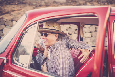 Senior couple sitting in car