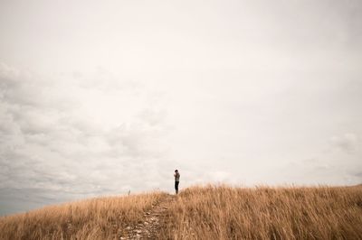 Full length of a man standing on landscape