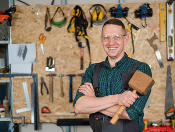 Portrait of smiling young man standing in store