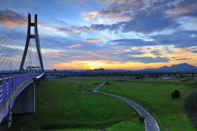 Scenic view of bridge against sky during sunset