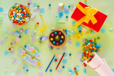 High angle view of multi colored candies on table