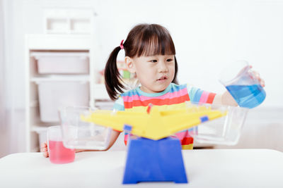 Young girl play balance toy for homeschooling