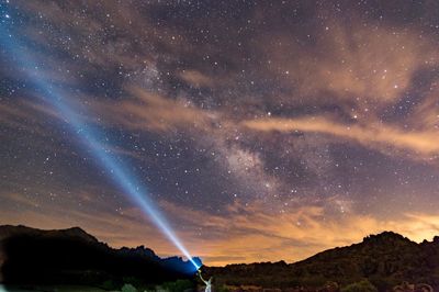 Scenic view of star field against sky at night