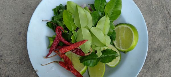 High angle view of fruits in plate on table
