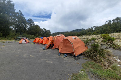 Tent on landscape against sky