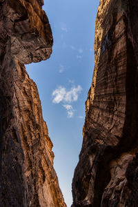 Low angle view of rock formation against sky