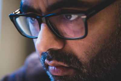 Close-up of man wearing eyeglasses