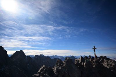 Panoramic view of mountains against blue sky