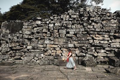 Woman standing in front of historical building