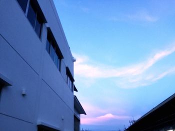 Low angle view of building against blue sky