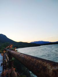 Scenic view of sea against clear sky during sunset